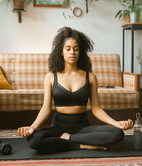 Woman practicing a gentle eye exercise in a calm, focused environment.